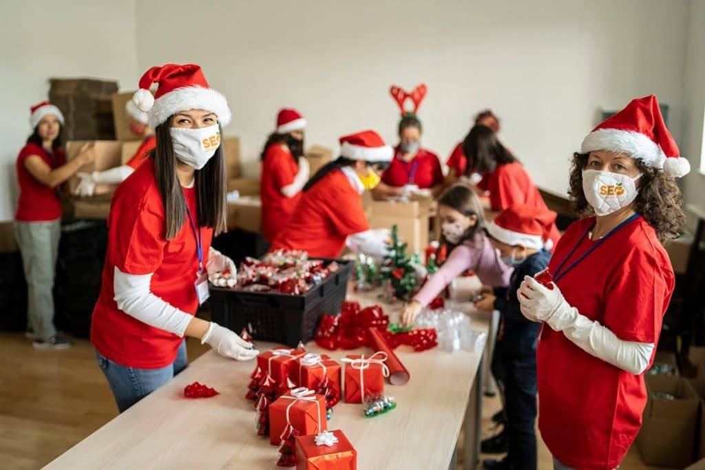SEO Company OC volunteers helping children at Christmas time in Orange County